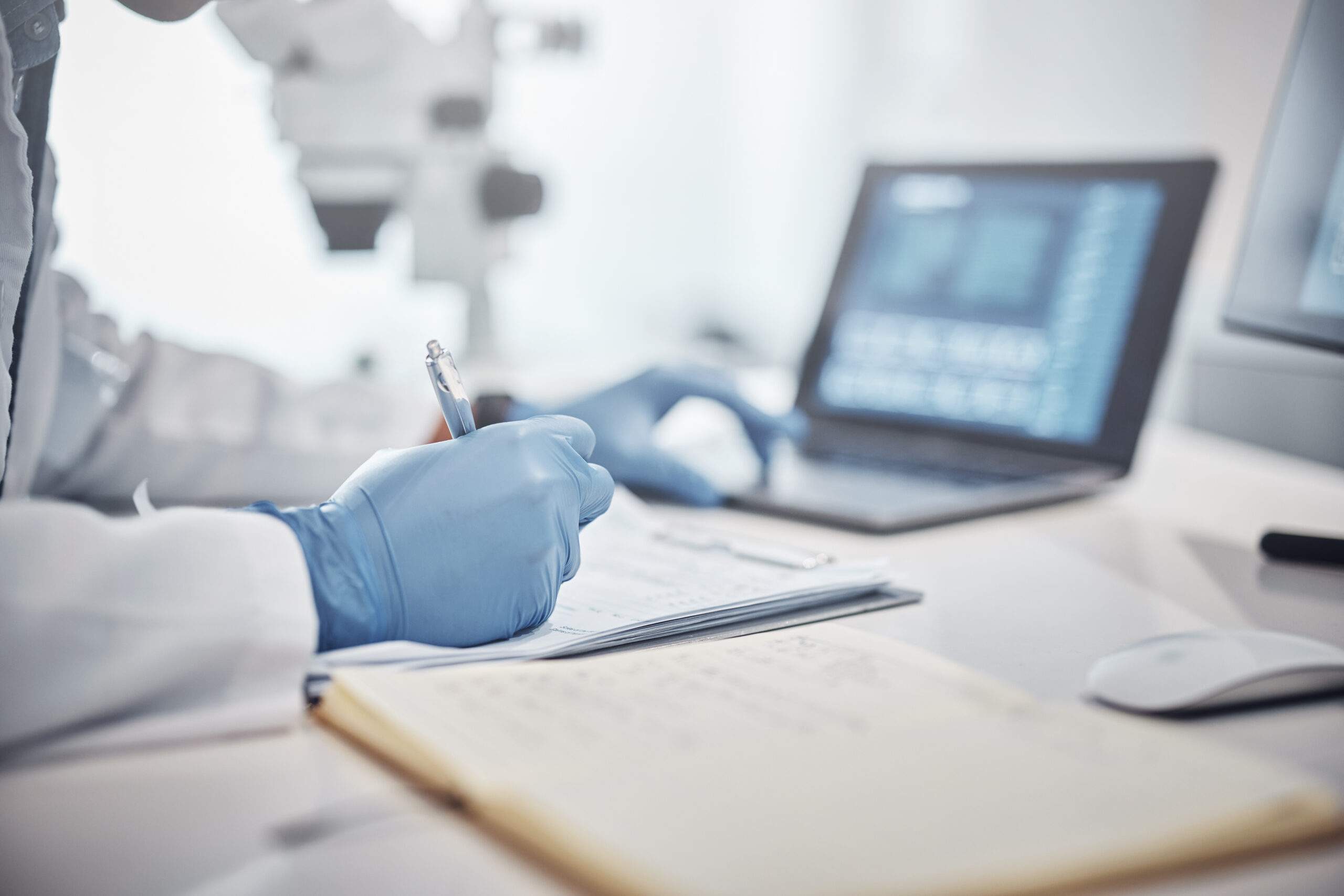 Scientist reviewing PK data analysis on laptop
